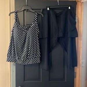 2 piece swimsuit. Only worn one time. Like new skirt with sewn in leggings.